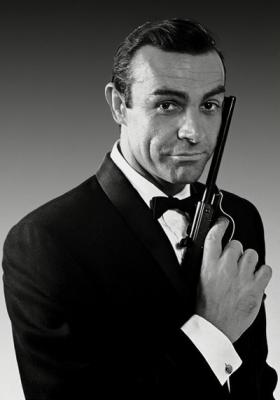 James Bond - sporting a classic tuxedo and handy firearm. -Image from Sean Connery Day
